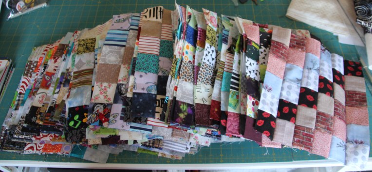 A quick snapshot of my first 80 blocks.  There are 320 more to come.  It's a wonderful project to just get your hands on the fabric.